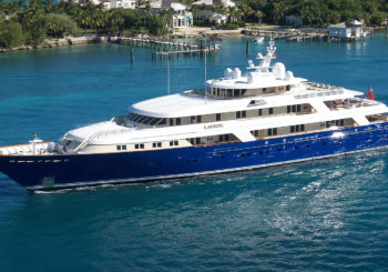 superyacht leaving tropical islands with yacht engineers
