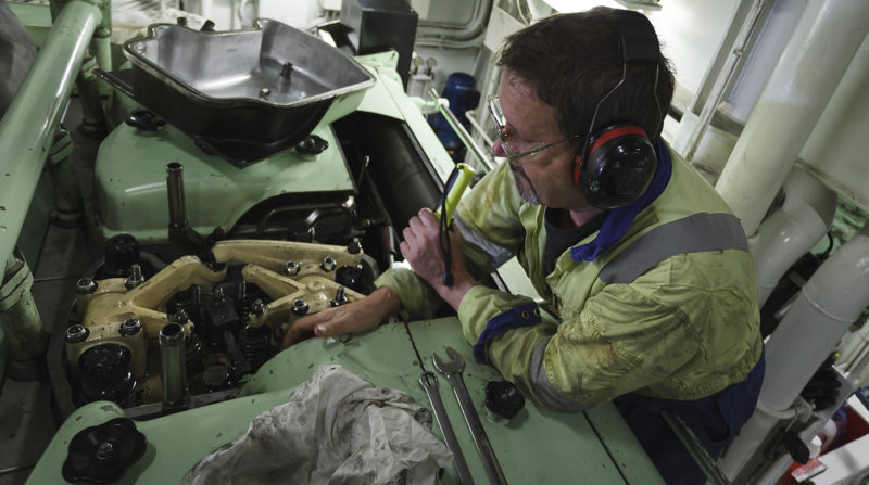 yacht engineer working on engine repairs